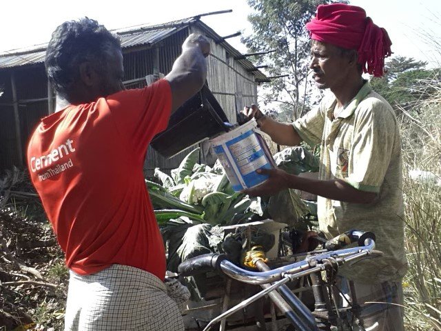 Villagers gathered around a Garden on Wheels project